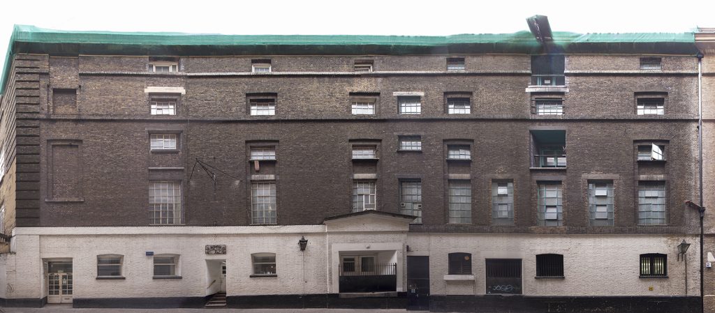 Facade of former 19th century brewery building at 10 Langley Street