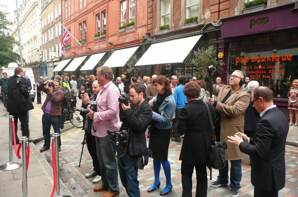 Press photographers at the unveiling of a plaque to Brian Epstein