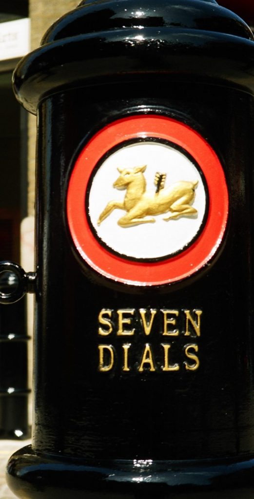 Photograph of detail of the Golden Hind motif and lettering on a Seven Dials bollard.