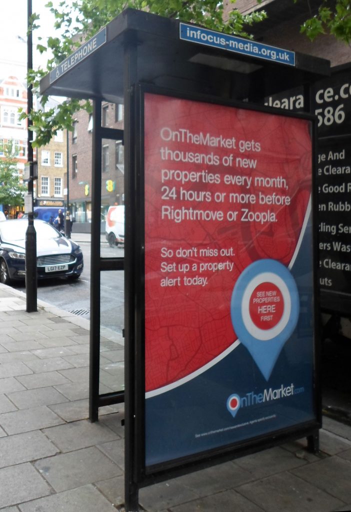 Modern public phonebox primarily used as advertising space