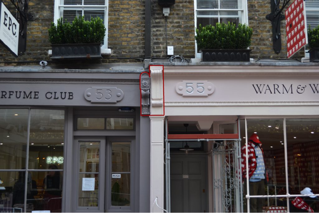 Two brackets highlighted on adjacent shopfronts on Monmouth Street